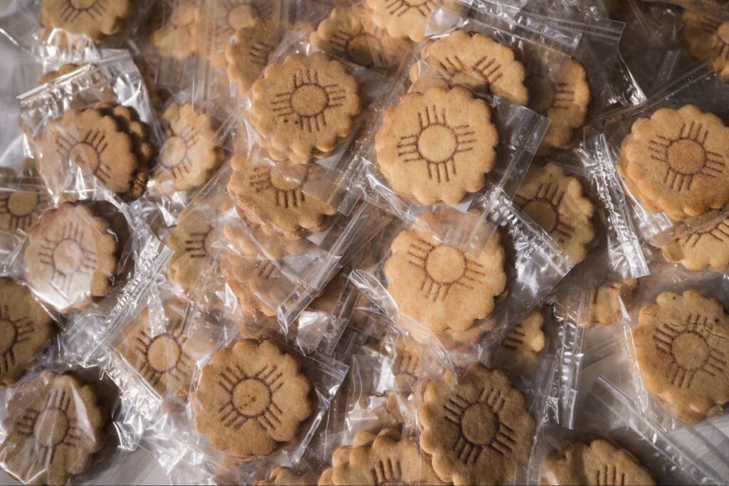 individually wrapped biscochito cookie wedding favors, stamped with a regional design. Incorporating local flavors to personalize your wedding.