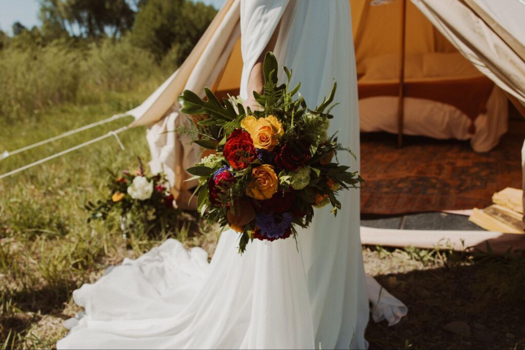 Bold bouquet of vibrant, textured flowers highlights 2025 wedding trends of statement colors and natural greenery.