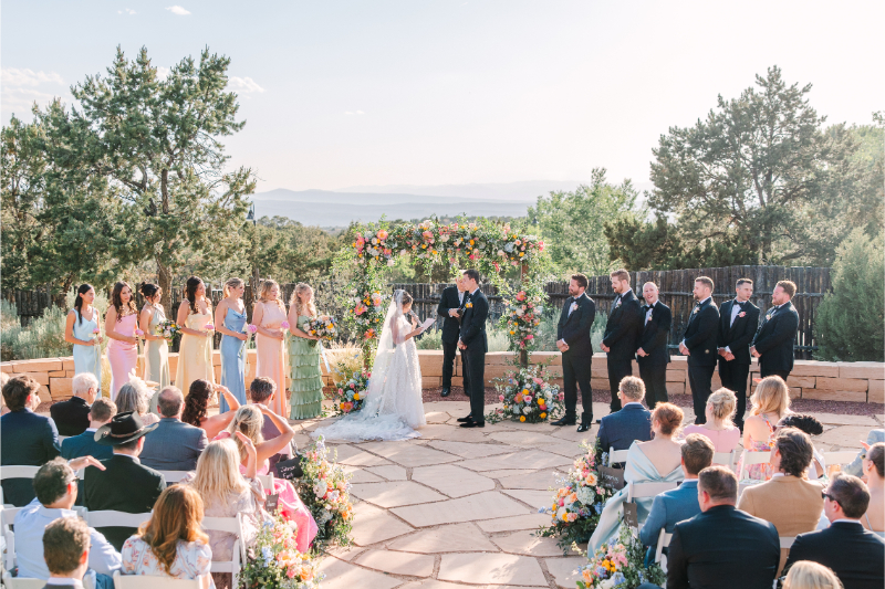 Bride and groom exchange vows, completely in the moment and not worrying about a timeline because they searched what does a wedding planner do and decide to hire Lace and Bow for their big day.