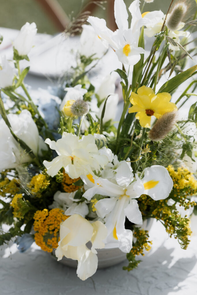 Close up of floral arrangement for garden wedding in the desert.