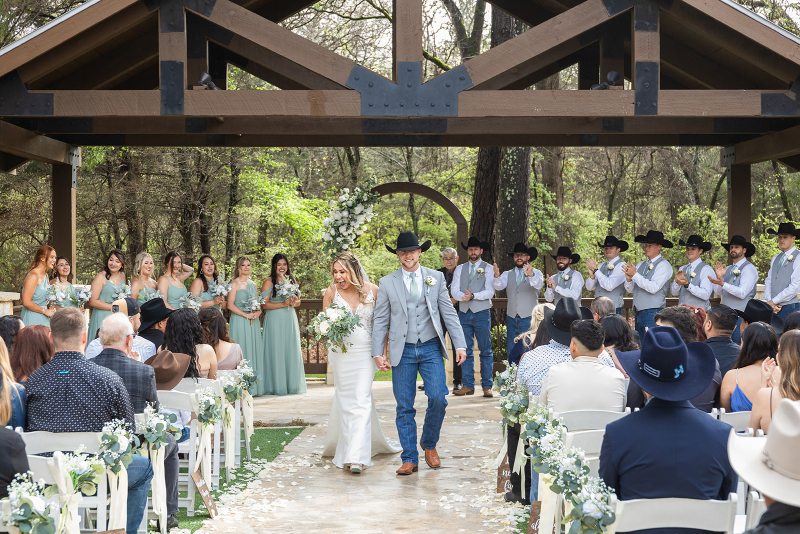 Bride and groom make grand exit after ceremony, fully soaking in the moment since their Tennessee wedding planner handled all the day's logistics.