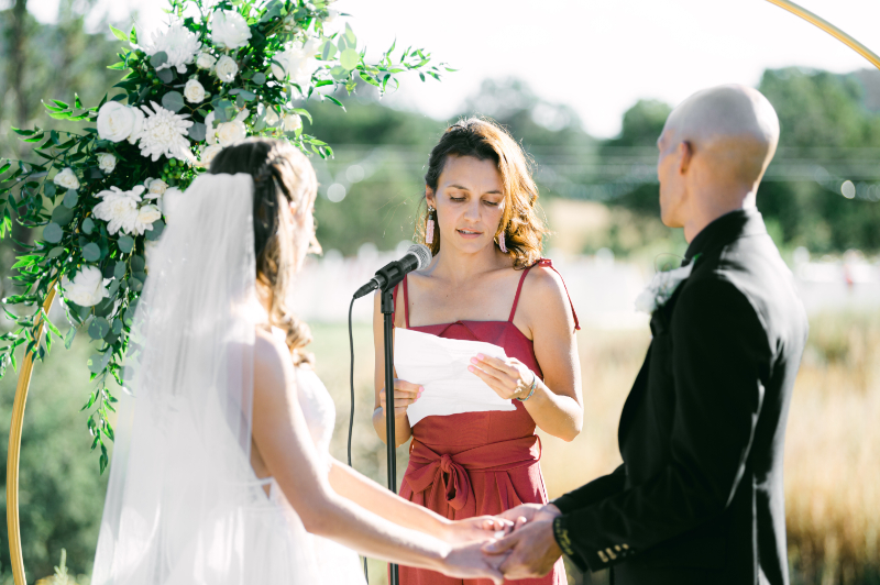 Friend of the bride and groom shares a special reading during non-traditional nuptials ceremony.