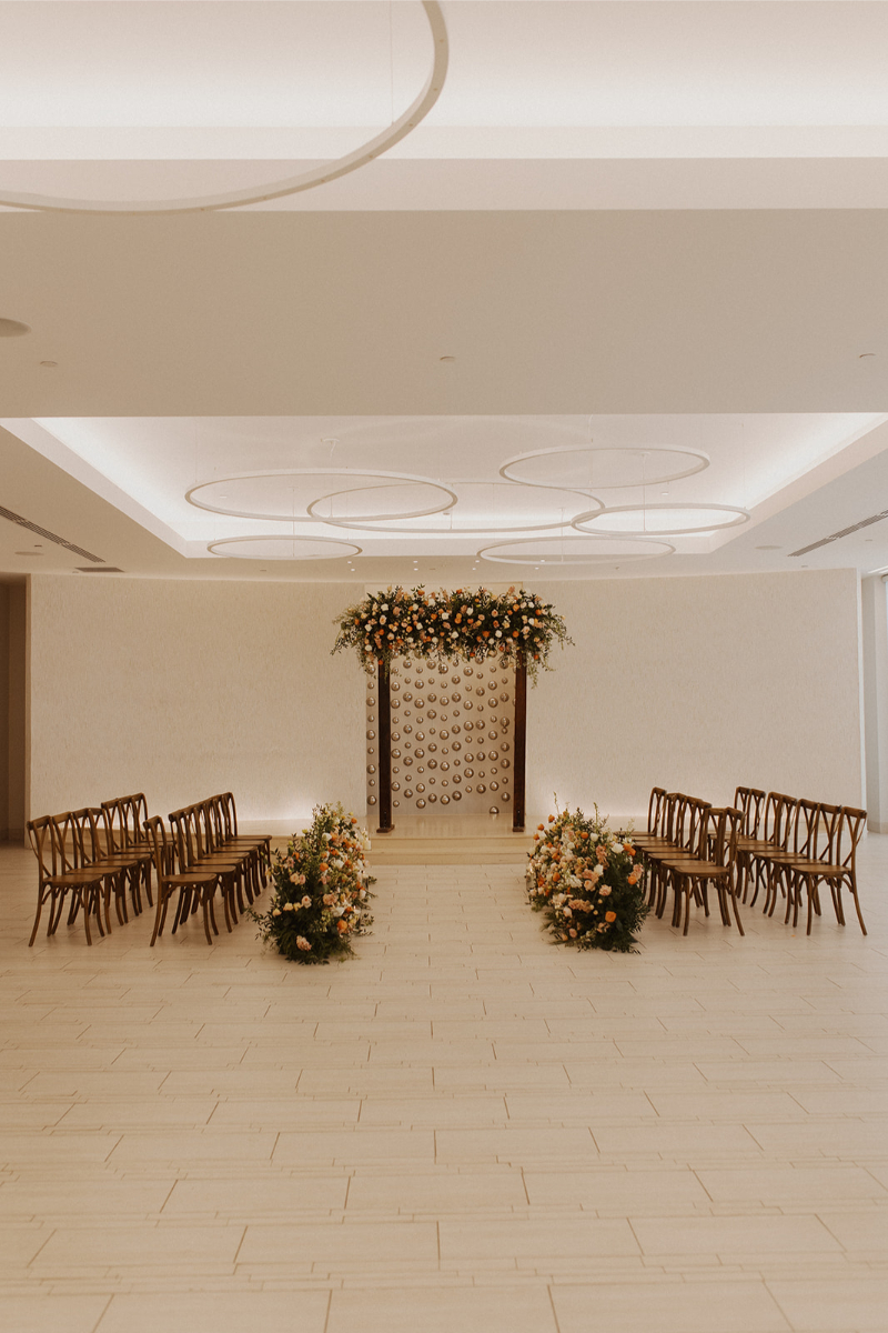 Floral lined wedding ceremony aisle decor