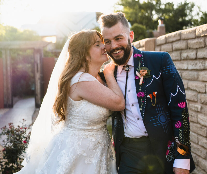 Bride and groom smiling, their wedding day order of events running smoothly.