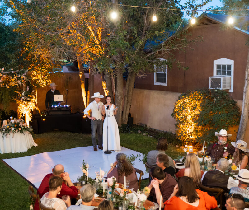 Bride and groom gives speech during welcome party, one of the events on their wedding weekend itinerary.