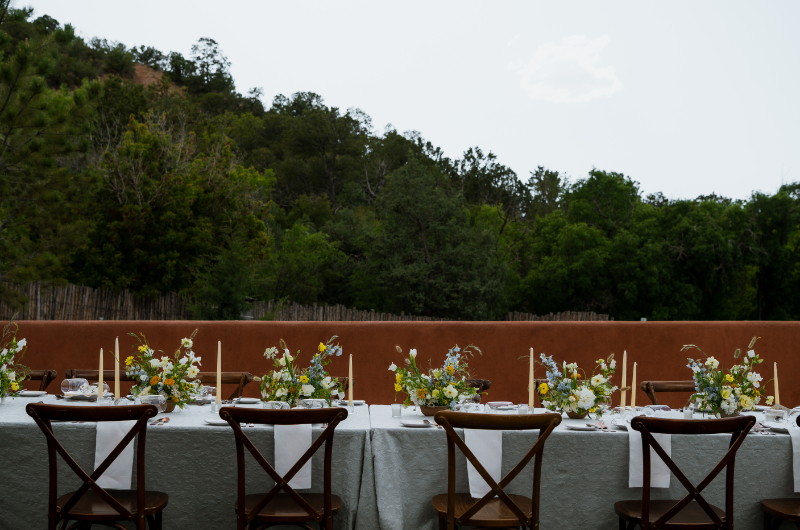 Reception table setting for garden wedding at Bishop's Lodge in New Mexico.