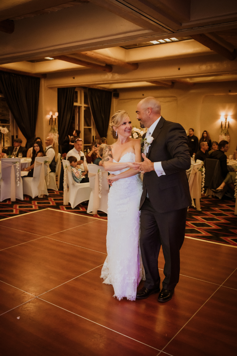 Bride and groom share first dance during reception.