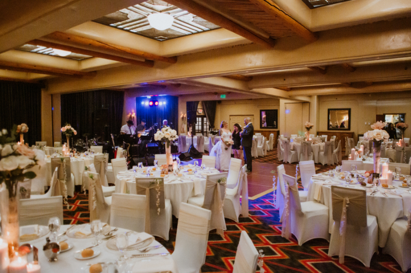 Ballroom decorated for wedding reception at the Inn and Spa at Loretto.