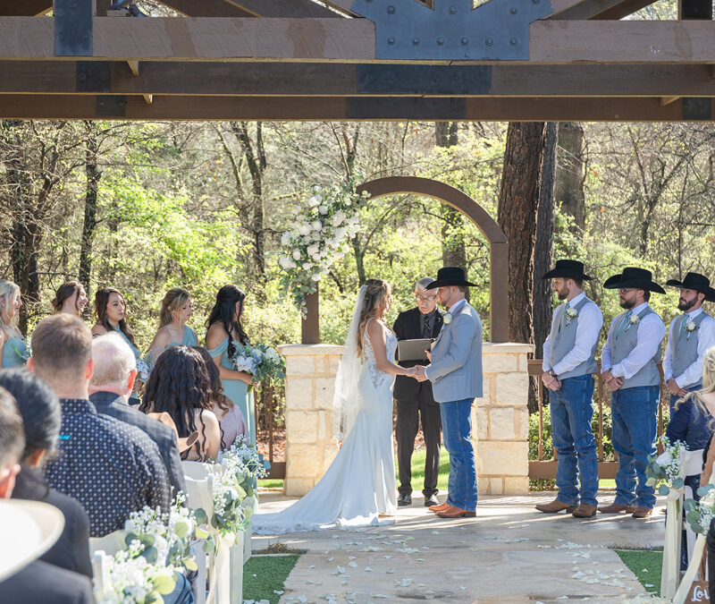 Bride and groom hold hands at the altar, fully enjoying the moment since their Tennessee wedding photographer handled all the logistics of the day.